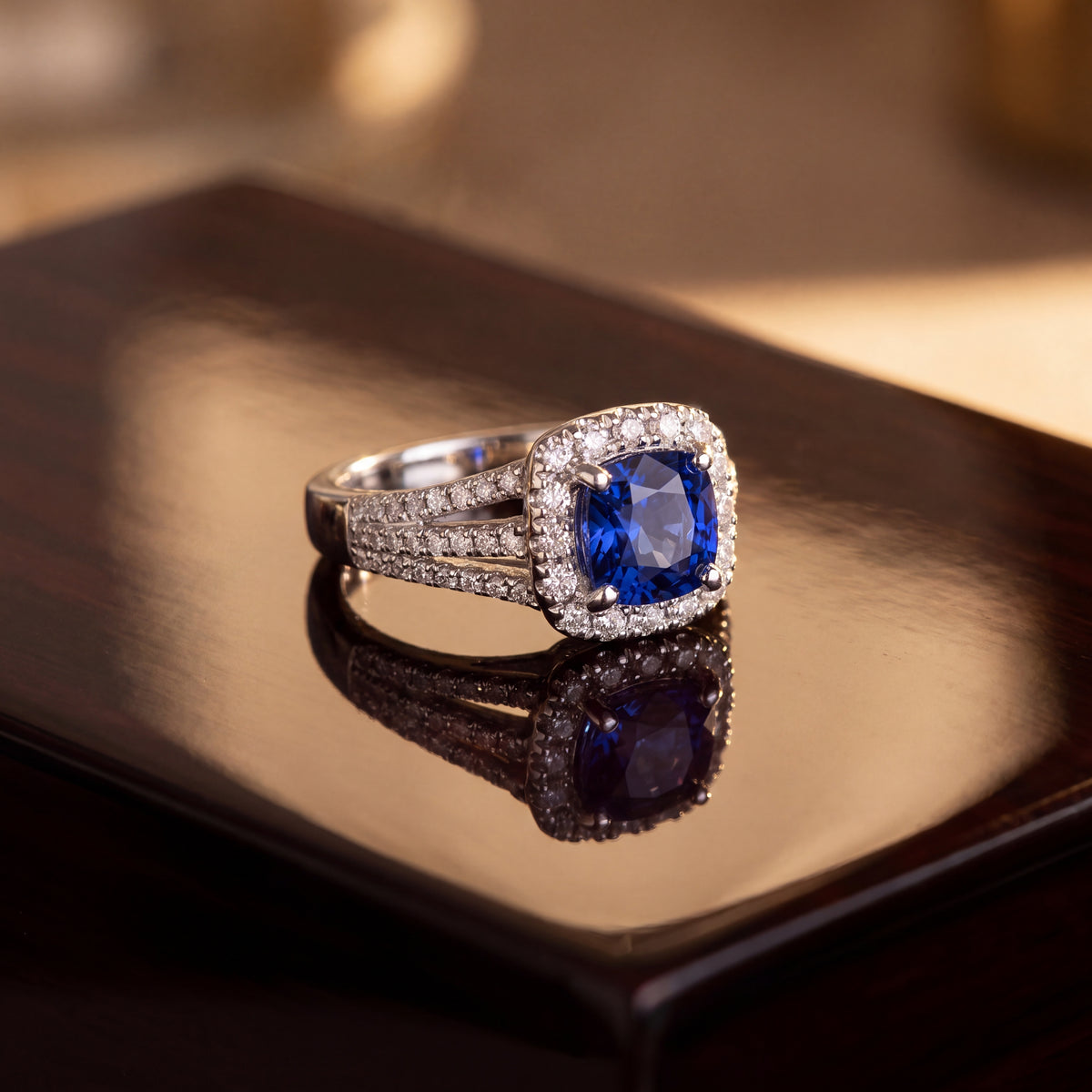 Cushion tanzanite in a diamond halo on a white gold split shank