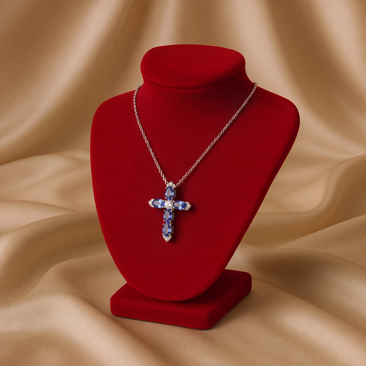 Cross pendant of five oval tanzanites with diamonds