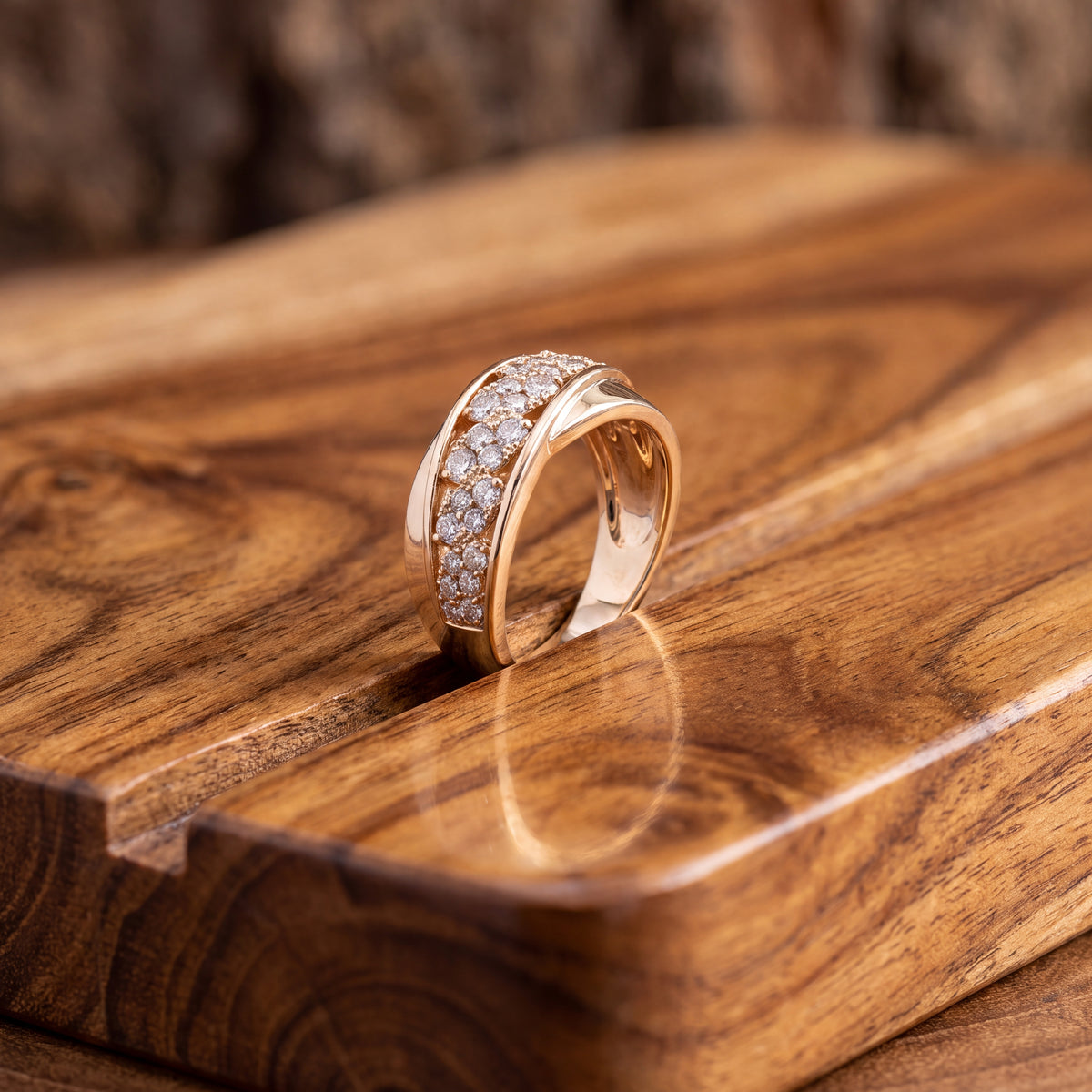 Wide yellow gold bypass ring with a diagonal band of diamonds