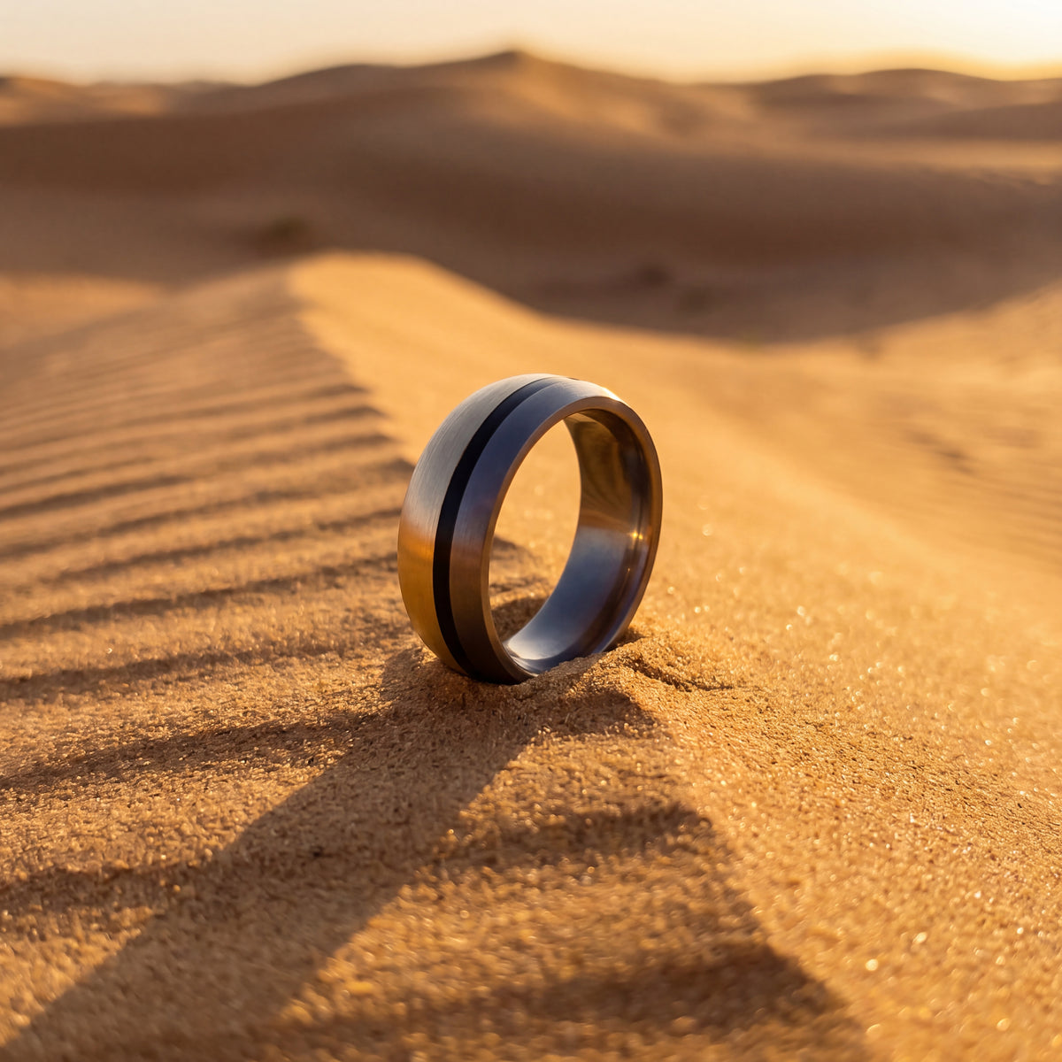 Brushed yellow gold and dark tantalum band with a center groove