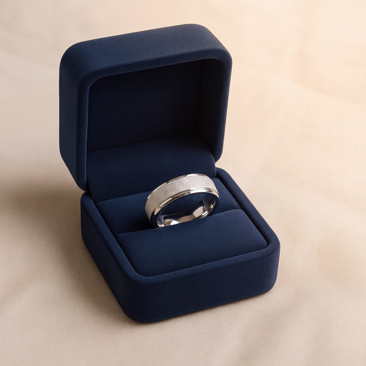 Flat white gold wedding band with a textured center