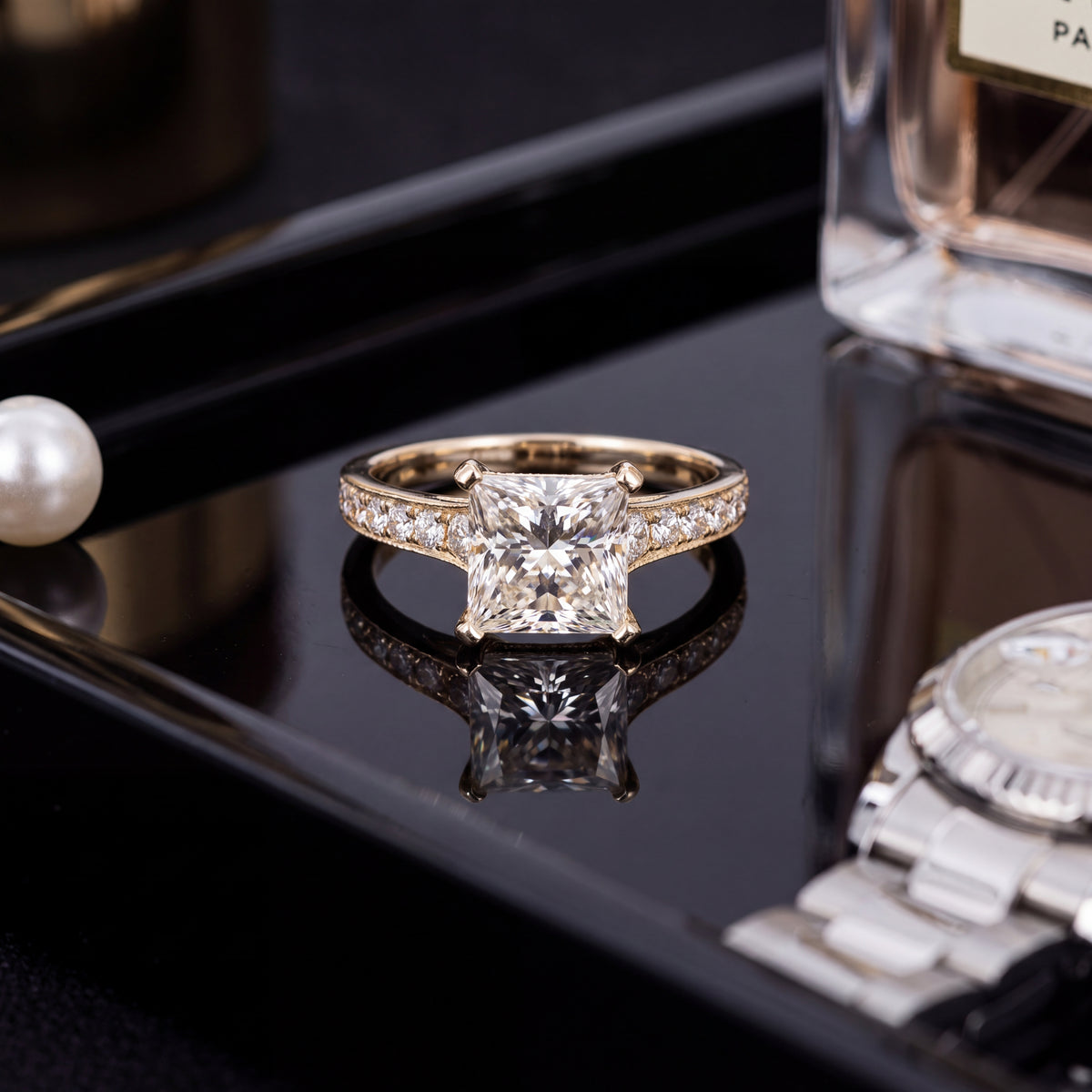 Princess-cut diamond engagement ring on a pavé band