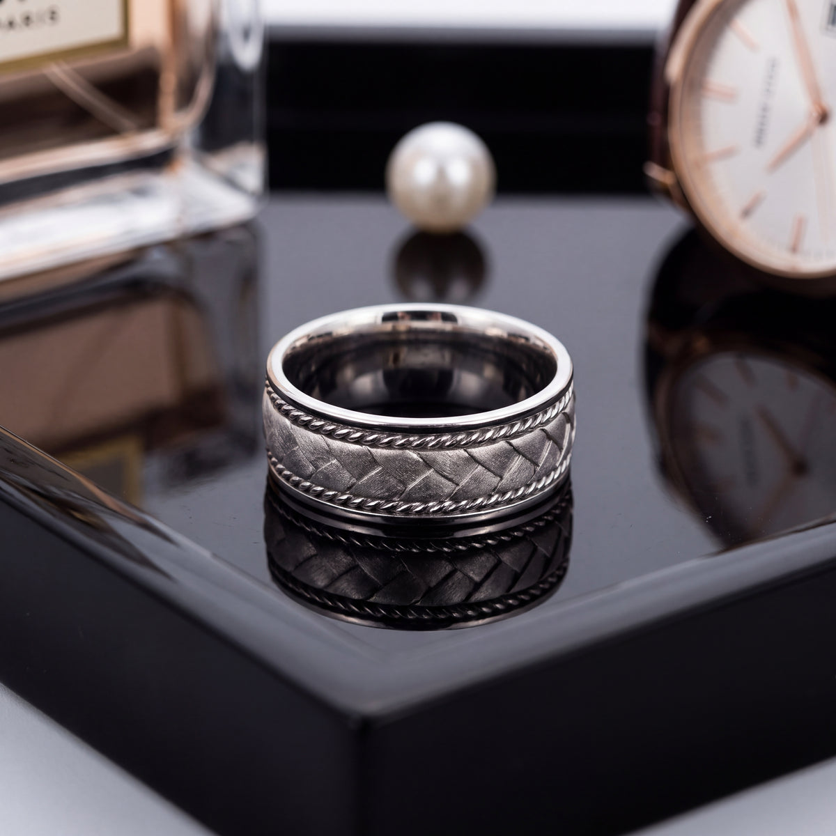 Braided white gold band with rope edges