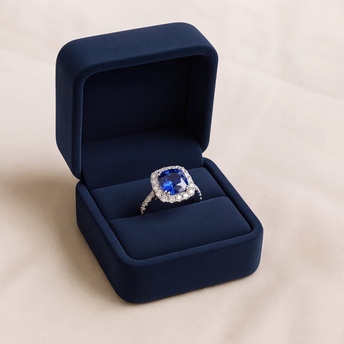 Cushion-cut tanzanite in a diamond halo, white gold band