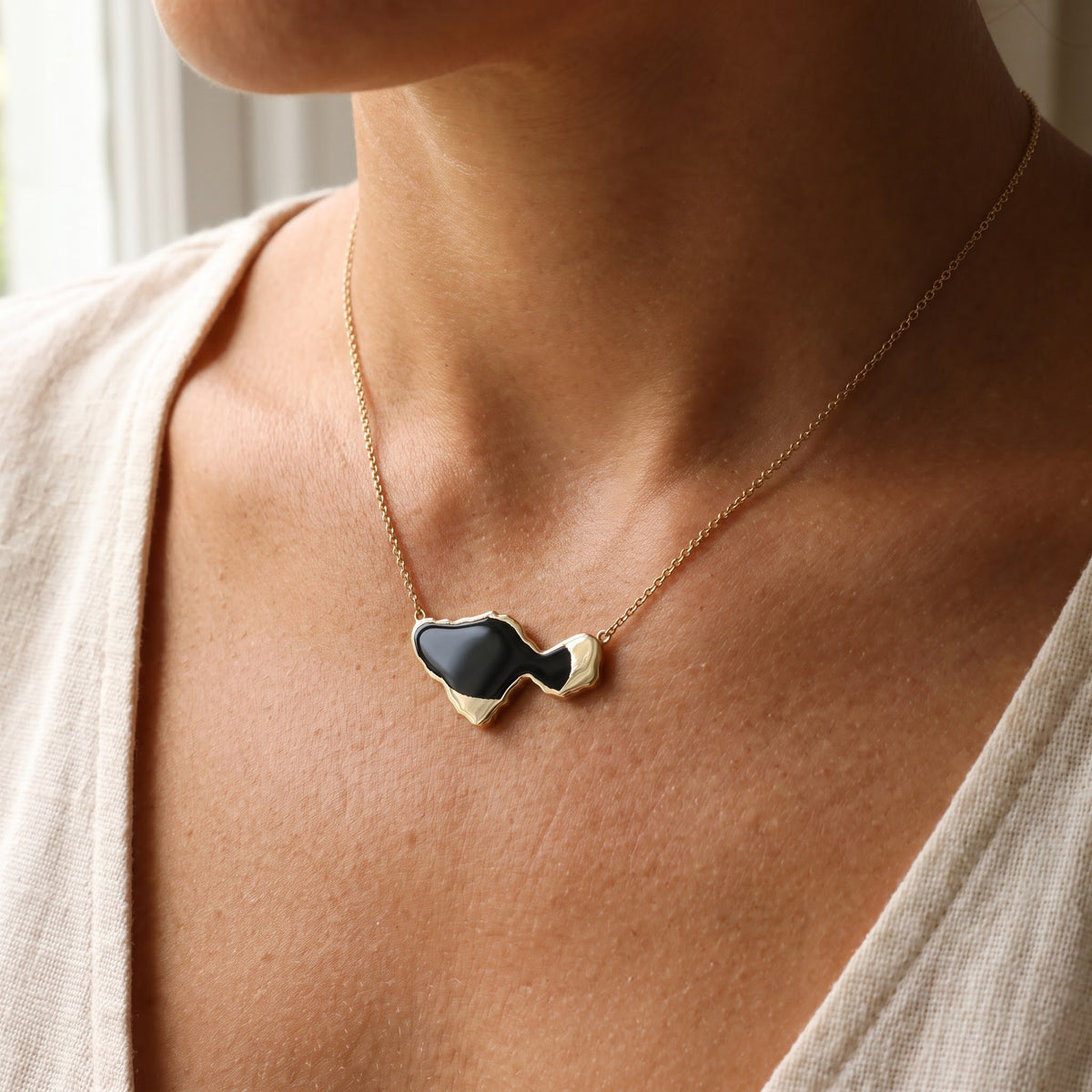 Abstract Onyx Pendant Necklace in Yellow Gold, worn