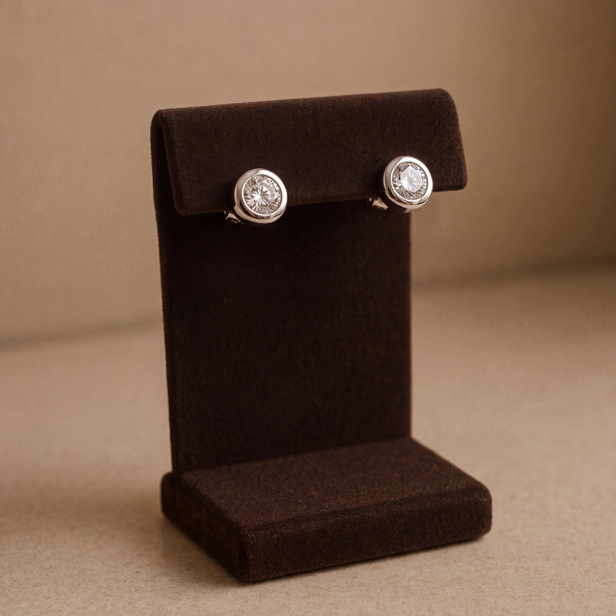 Pair of round diamond studs in platinum bezels