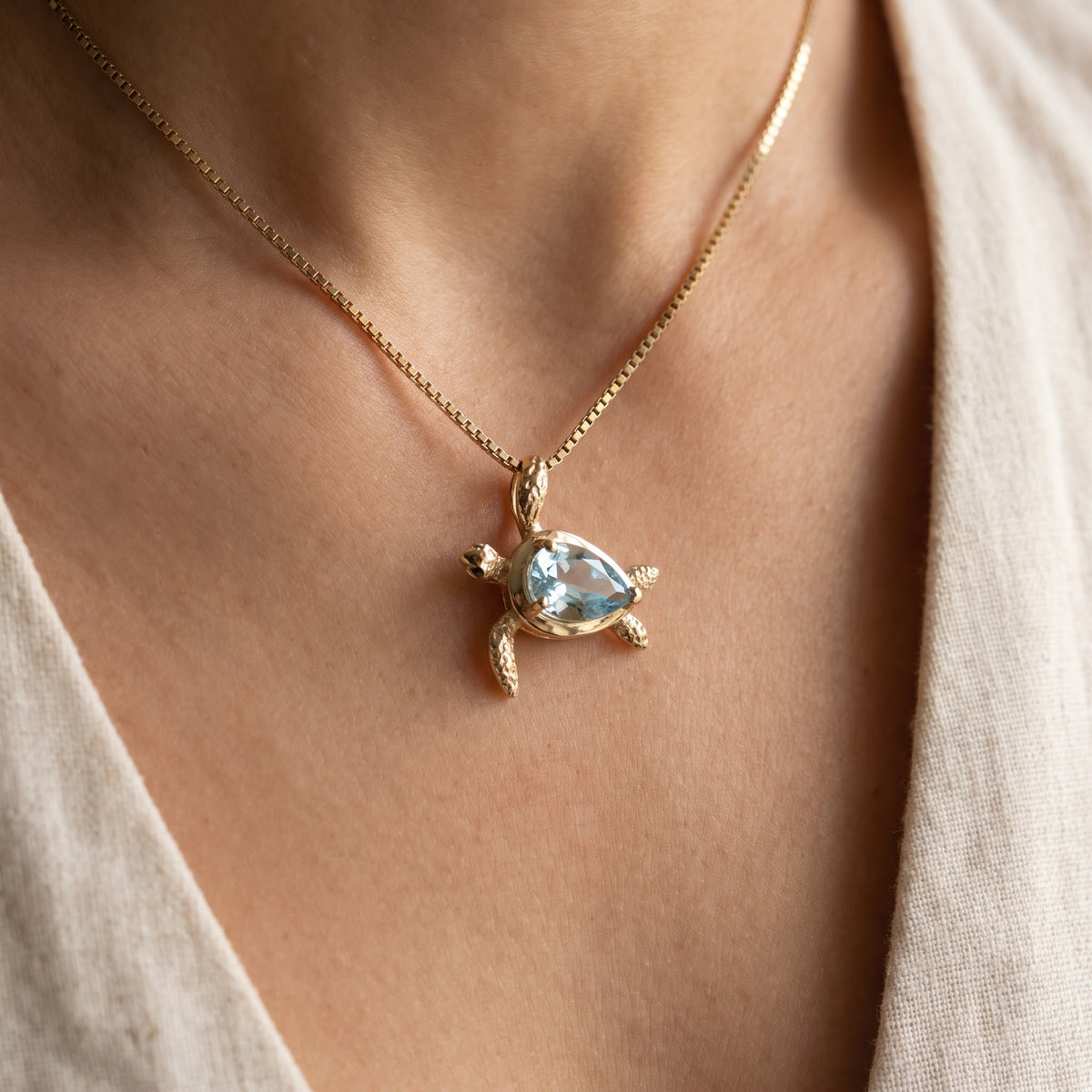 Aquamarine Sea Turtle Pendant Necklace in Yellow Gold, worn