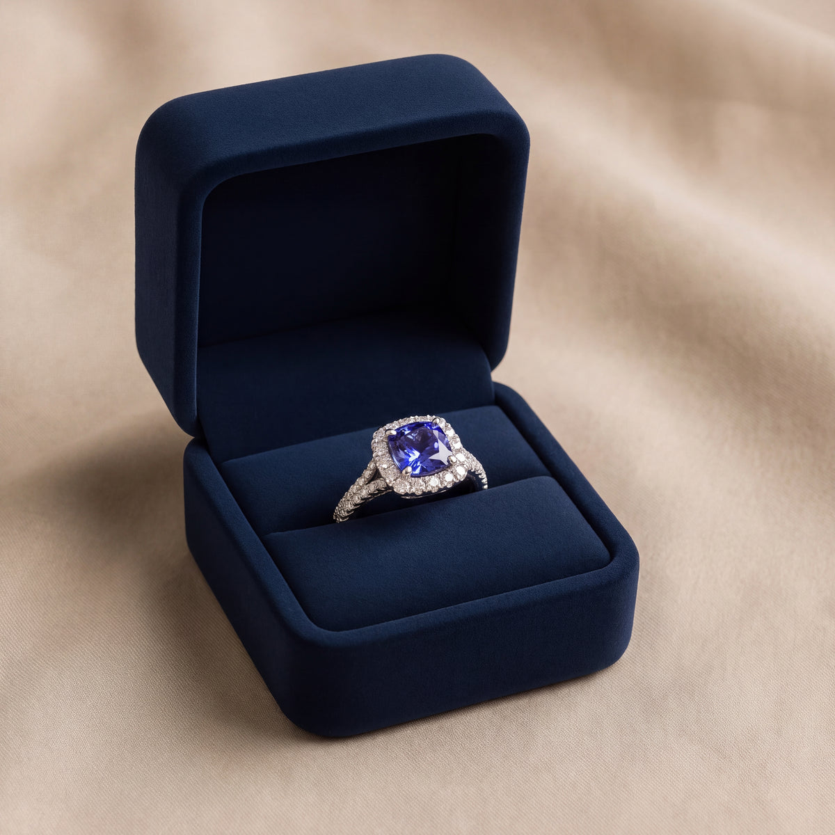 Tanzanite in a diamond halo on a pavé split shank