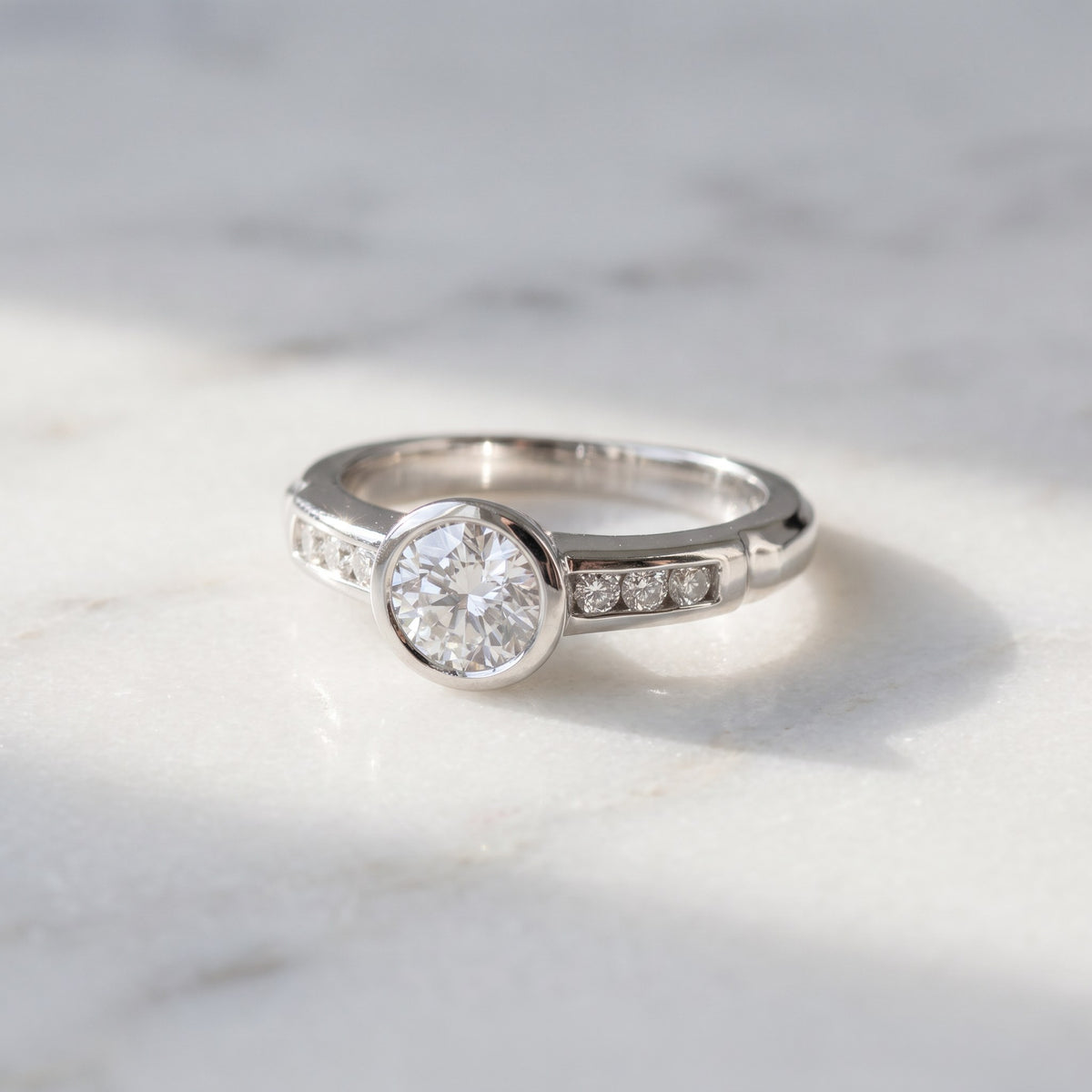 0.75 ct Bezel-Set Diamond Ring with Channel Accents in Platinum