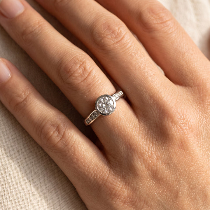 0.75 ct Bezel-Set Diamond Ring with Channel Accents in Platinum, worn