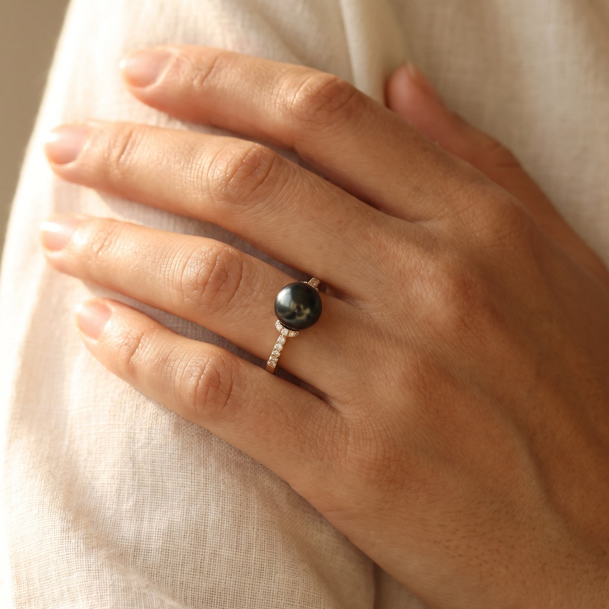 Black Pearl and Diamond Accent Solitaire Ring in Yellow Gold, worn