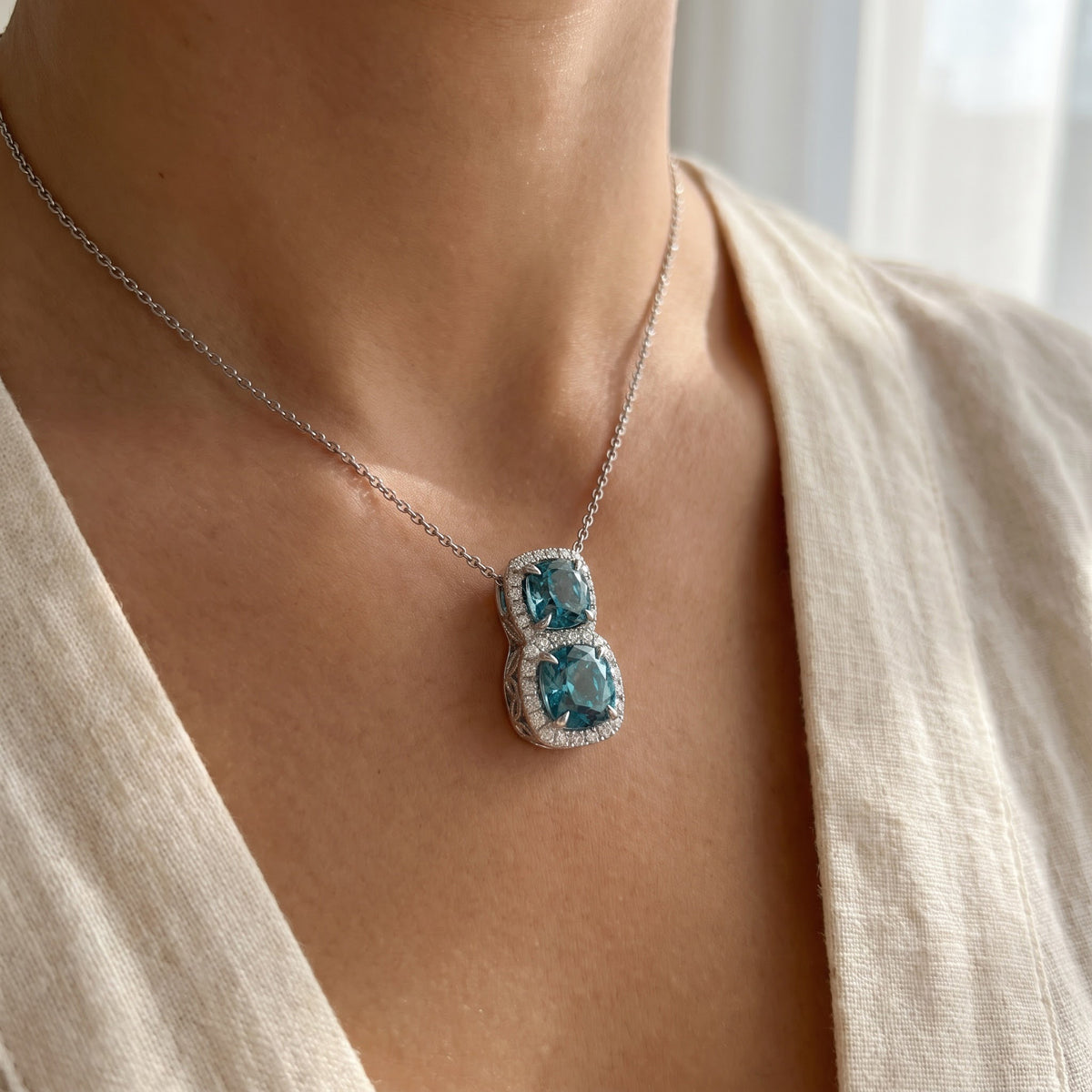 Blue Zircon Diamond Double Halo Pendant — White Gold, worn