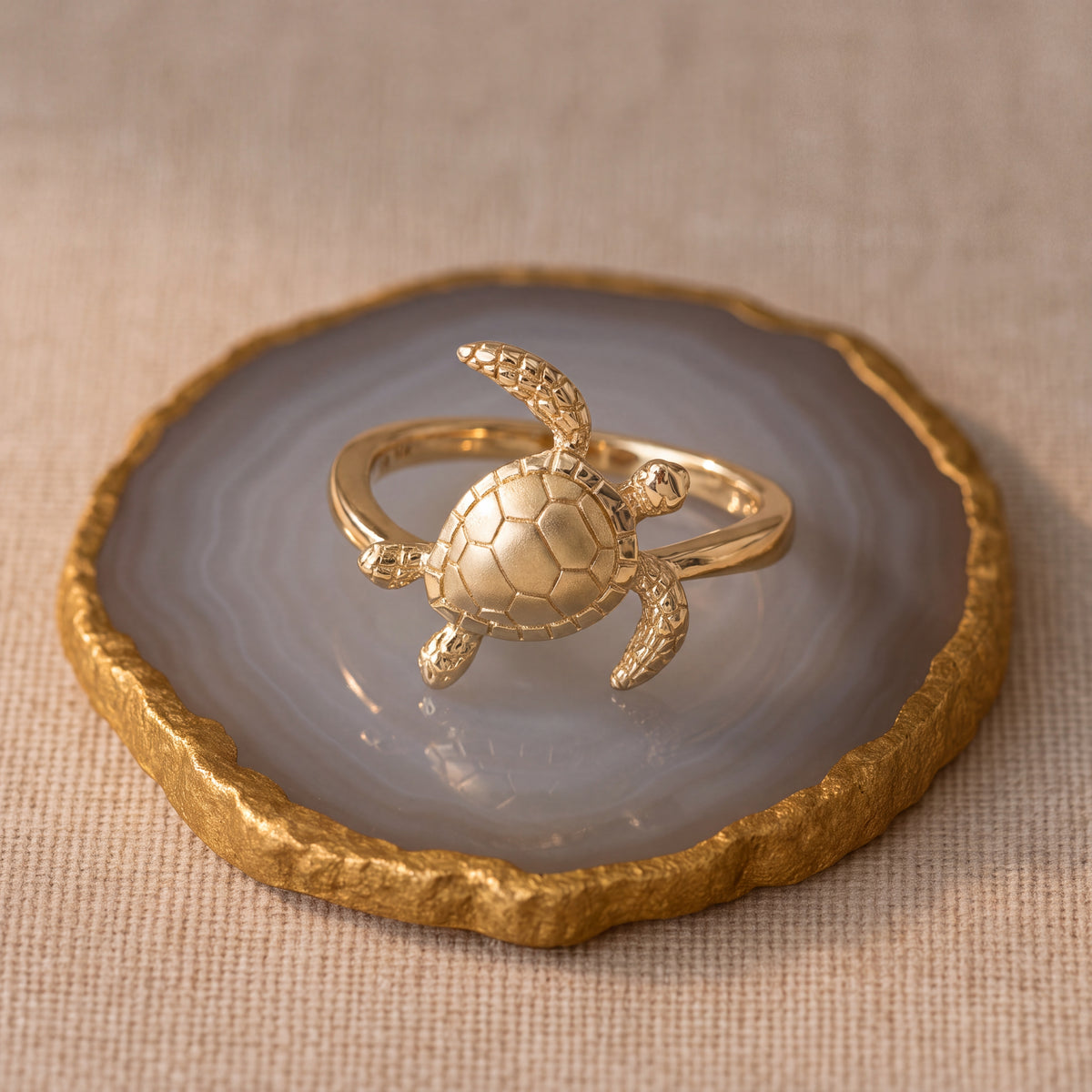 Yellow gold ring with a textured sea turtle