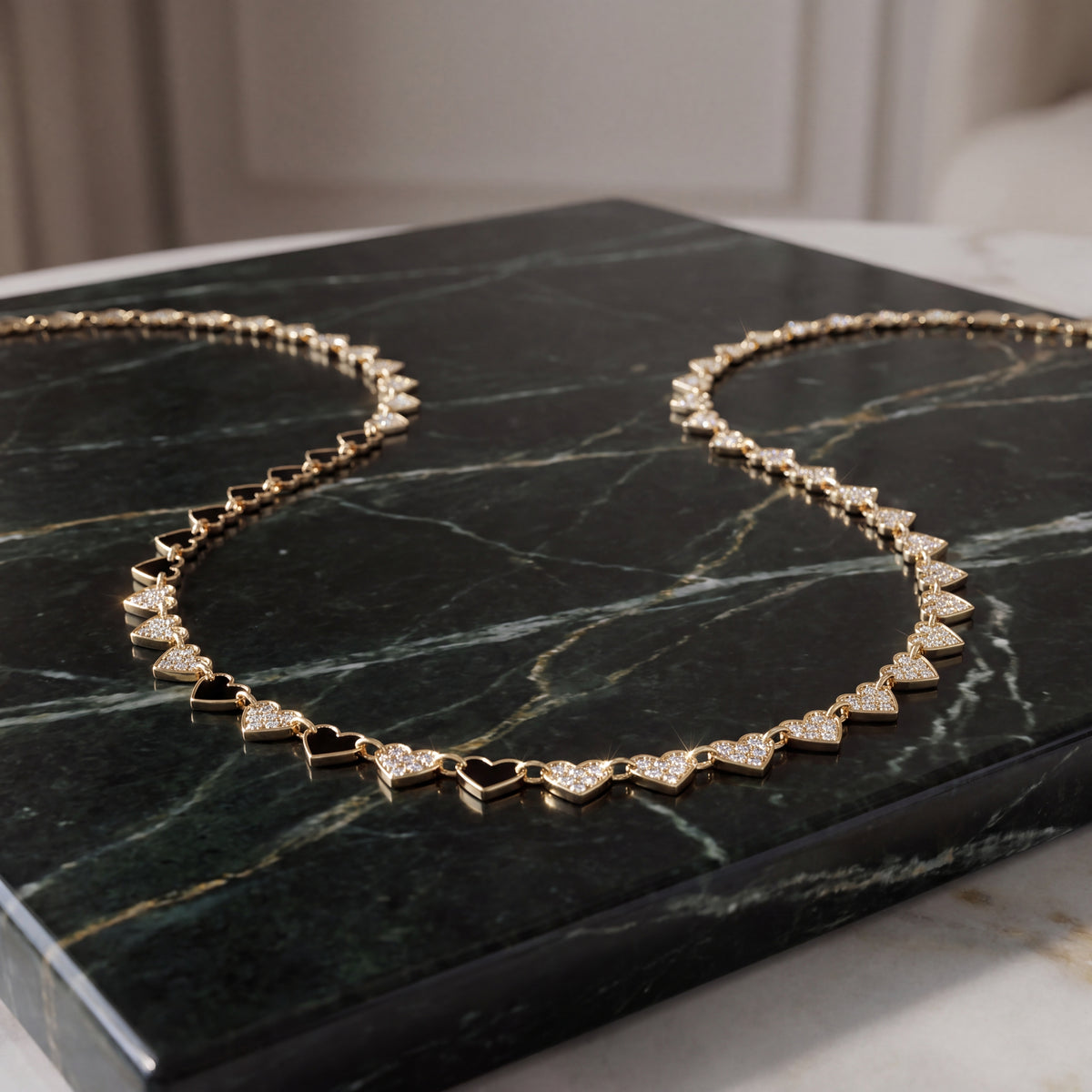 Necklace of flat polished yellow gold heart links