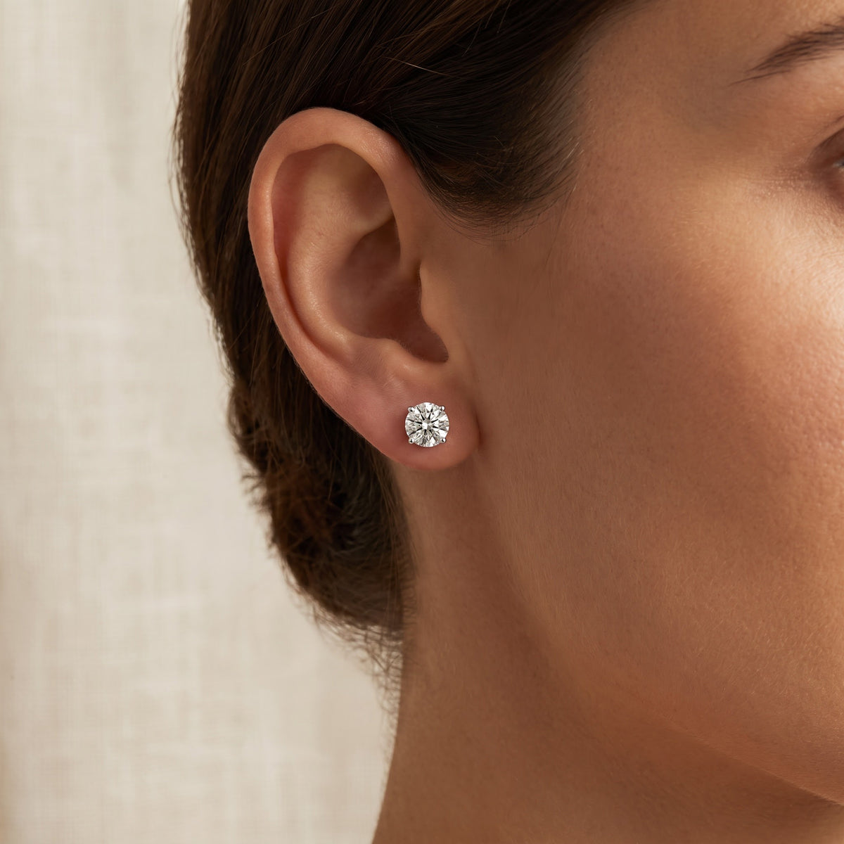 Classic Round Brilliant Cut Diamond Stud Earrings in White Gold, worn