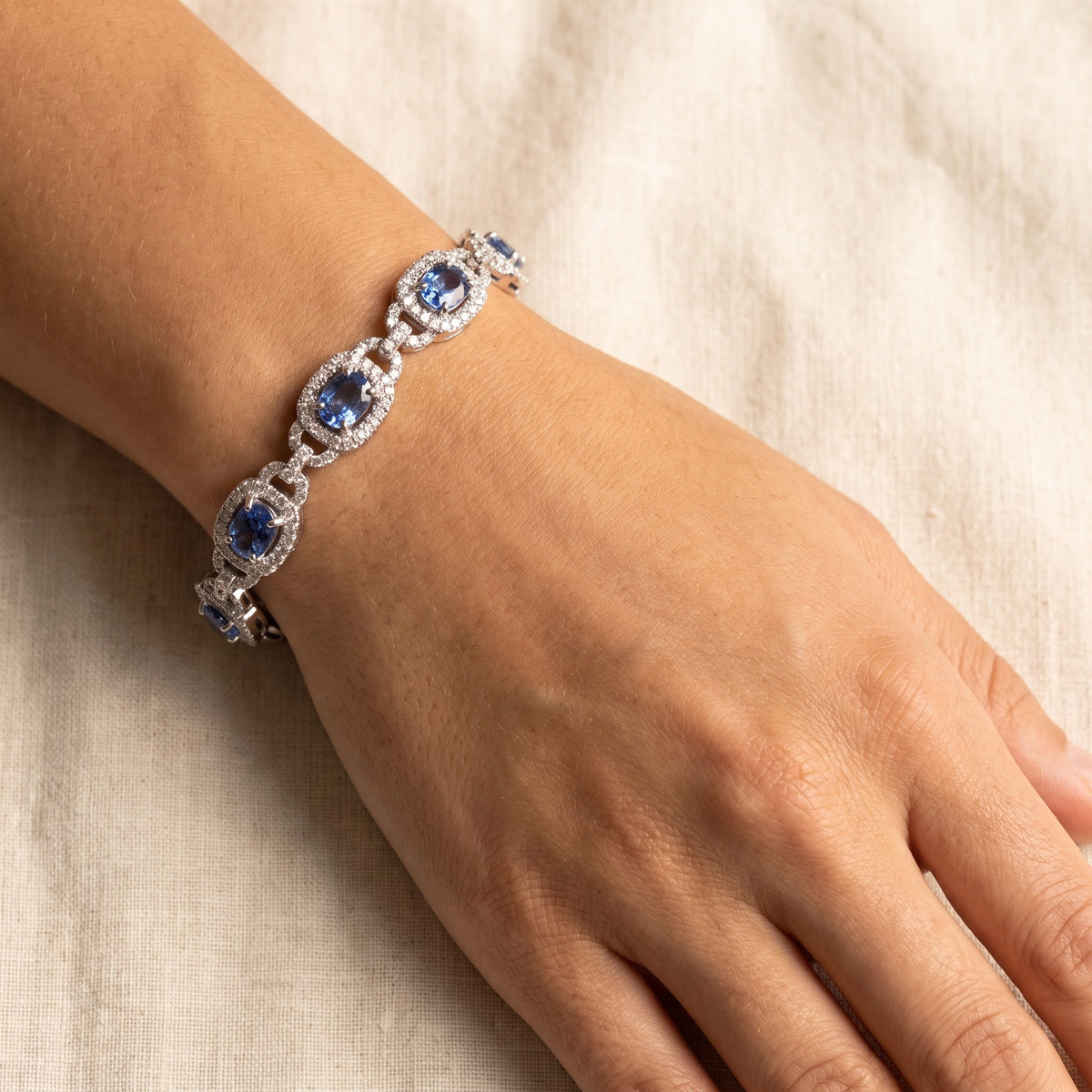 Cornflower Blue Sapphire Halo Chain Bracelet in White Gold, worn