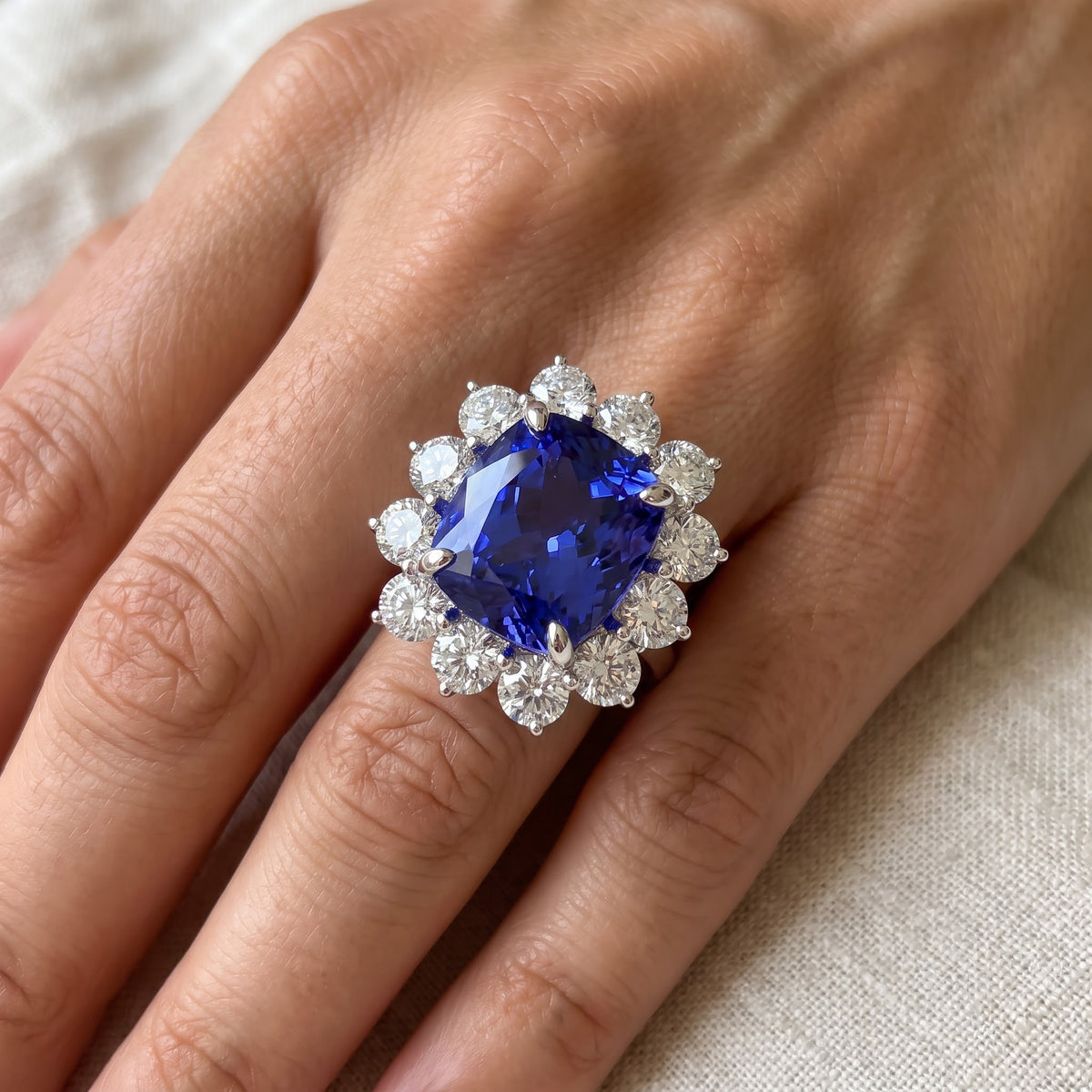 Cushion-Cut Tanzanite and Diamond Halo Cocktail Ring in 14K White Gold, worn