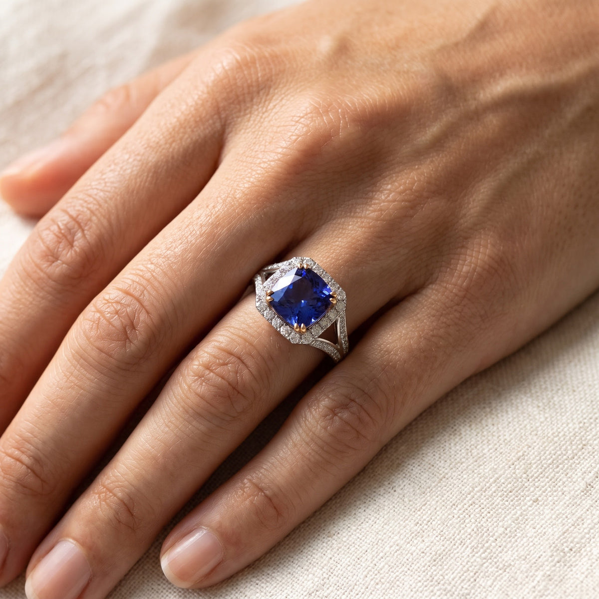 Cushion-Cut Tanzanite Diamond Halo Cocktail Ring in 18K White Gold, worn