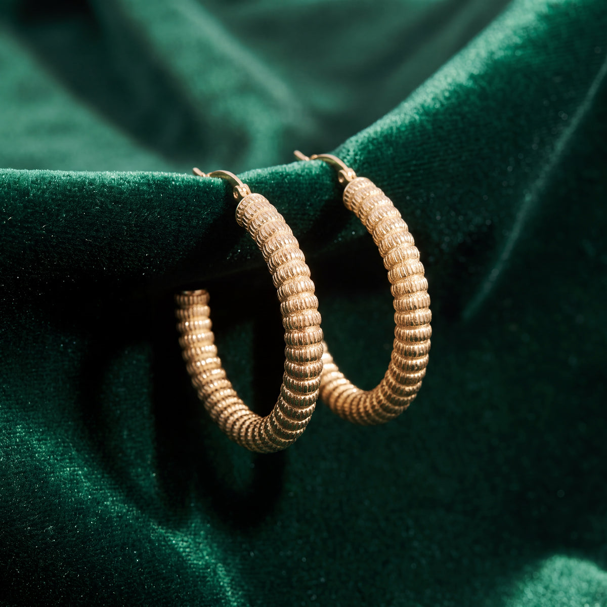 Ribbed yellow gold hoop earrings