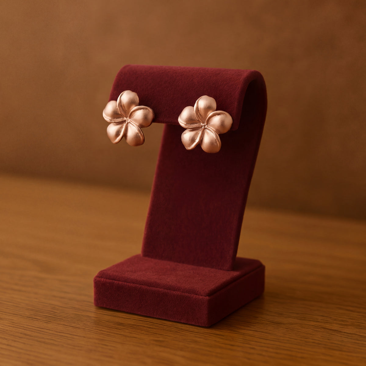 Matte rose gold plumeria flower stud earrings