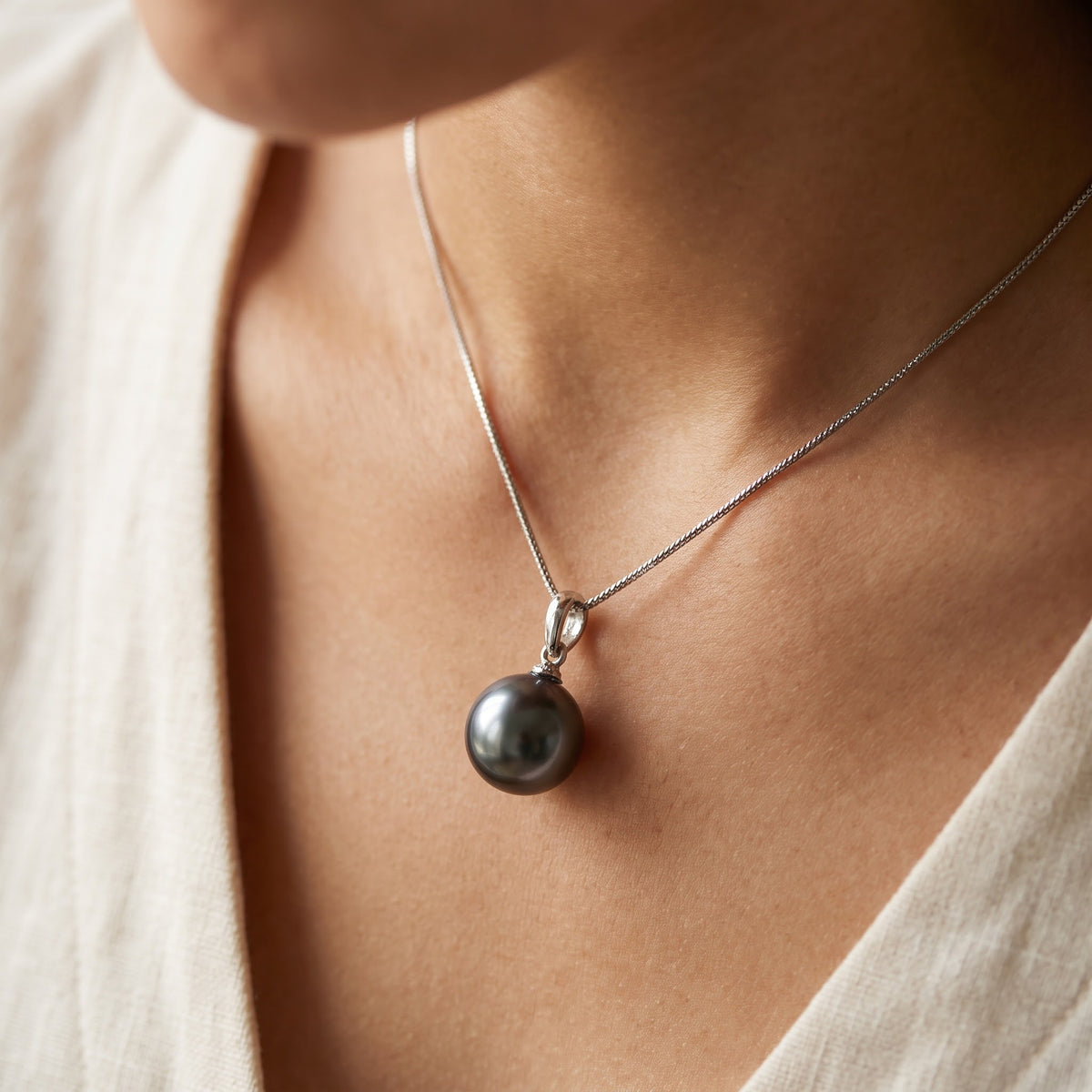 Dark Pearl Solitaire Pendant Necklace in White Gold, worn