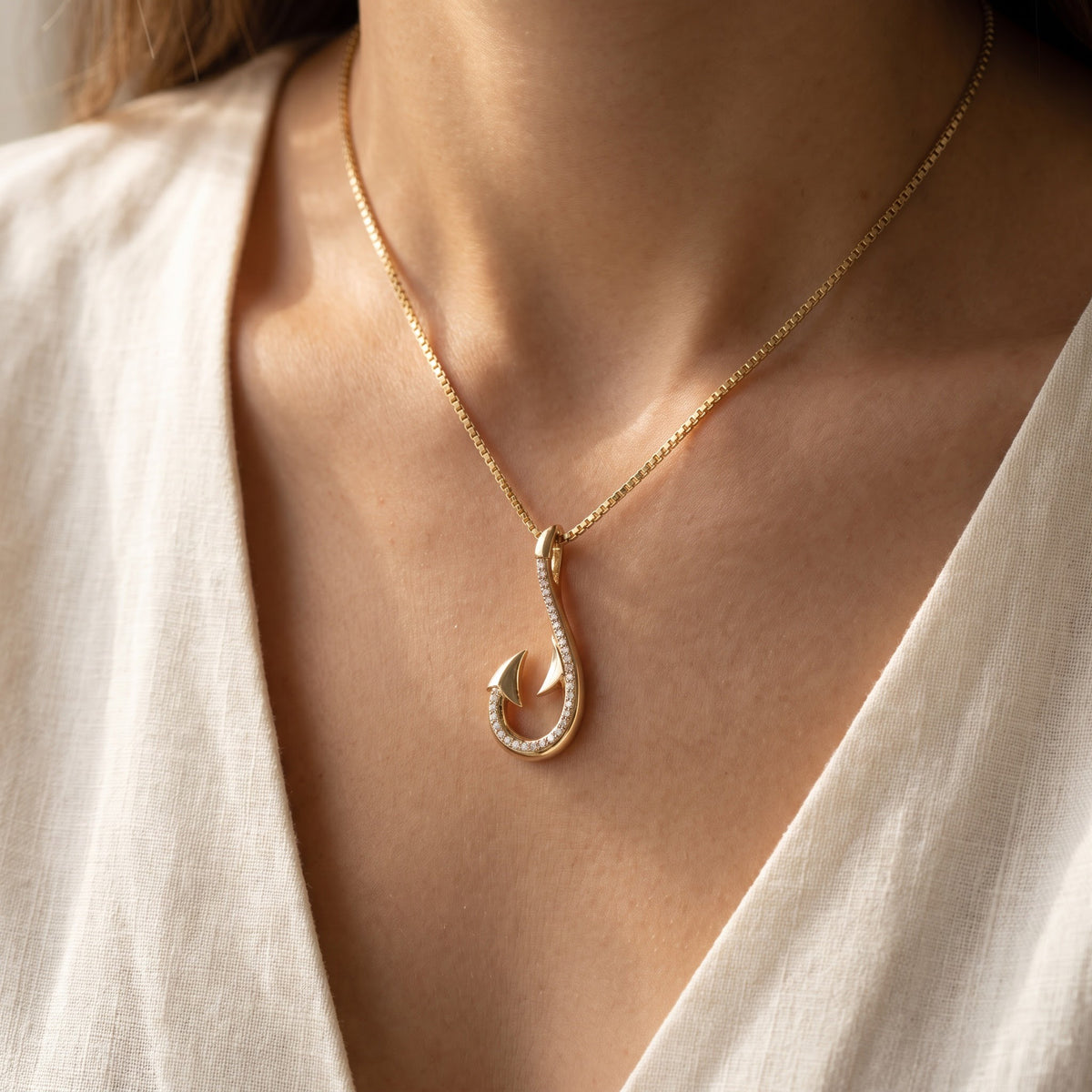 Diamond Accented Fish Hook Pendant in 14K Yellow Gold, worn