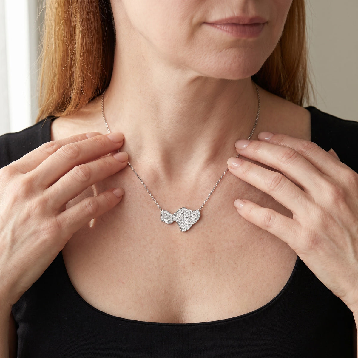 Diamond Pave Island Silhouette Charm Necklace in White Gold, worn, second view