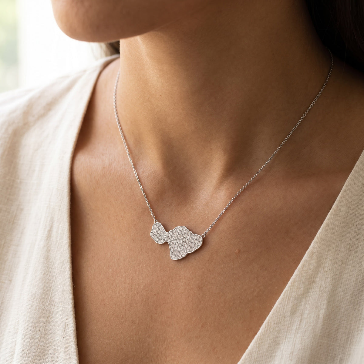 Diamond Pave Island Silhouette Charm Necklace in White Gold, worn