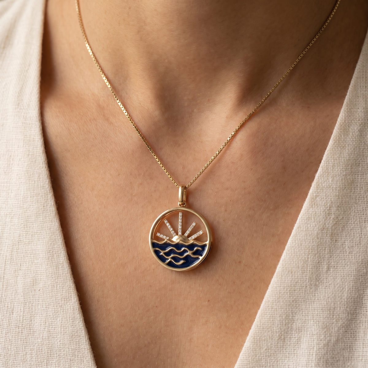 Diamond Sunburst and Wave Pendant Necklace in Yellow Gold, worn