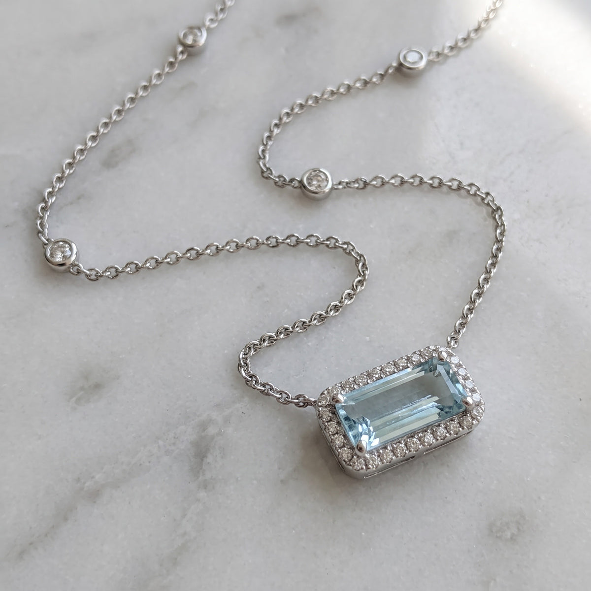 East-West Aquamarine Halo Necklace in White Gold
