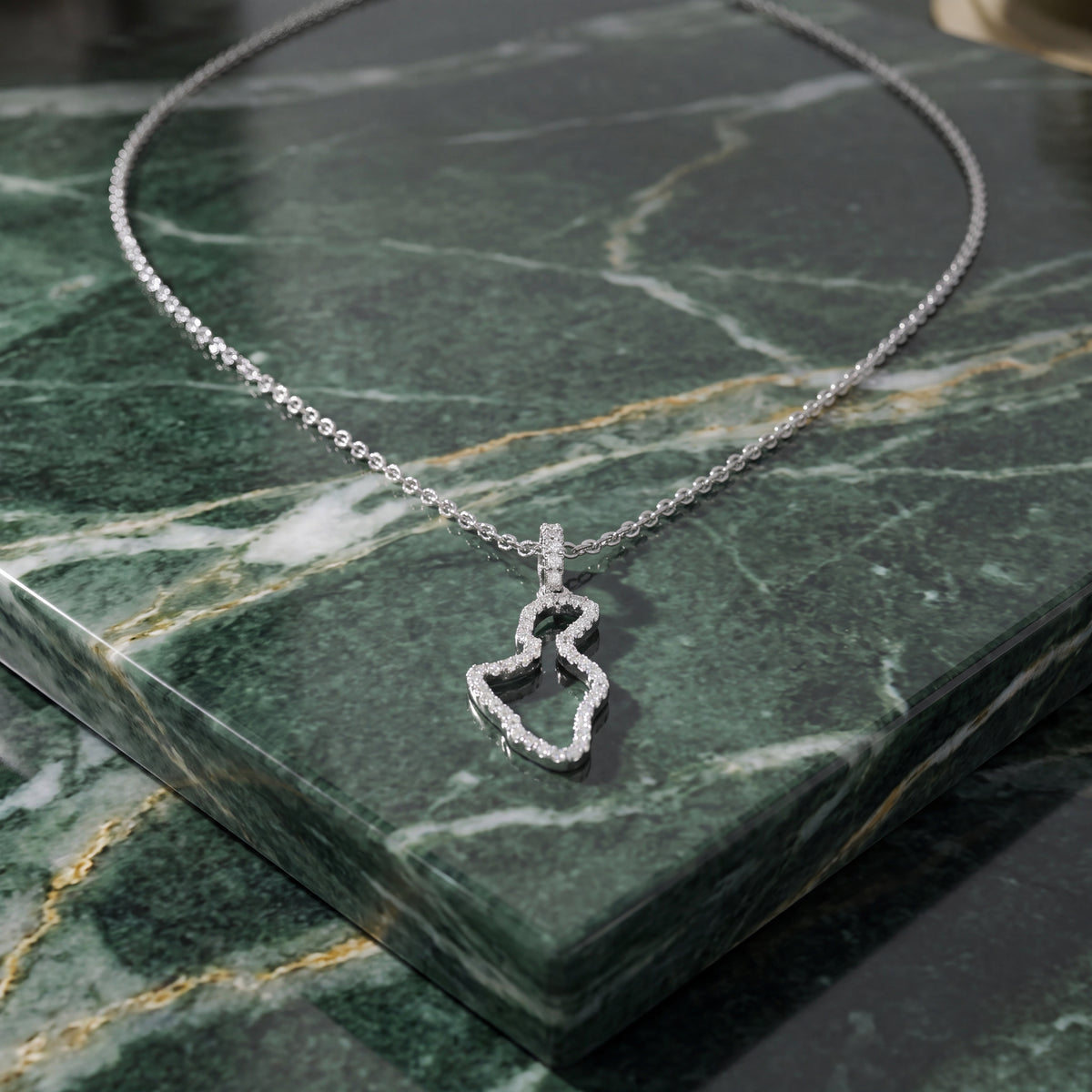 White gold pendant outlining the island of Maui in diamonds