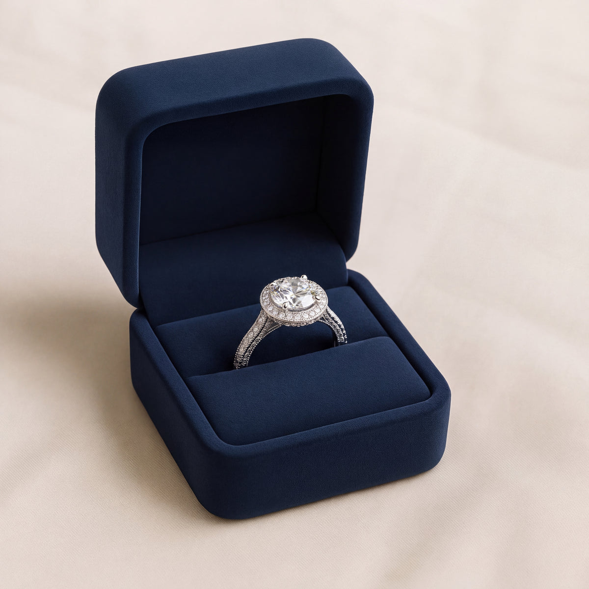 Round diamond halo engagement ring in white gold