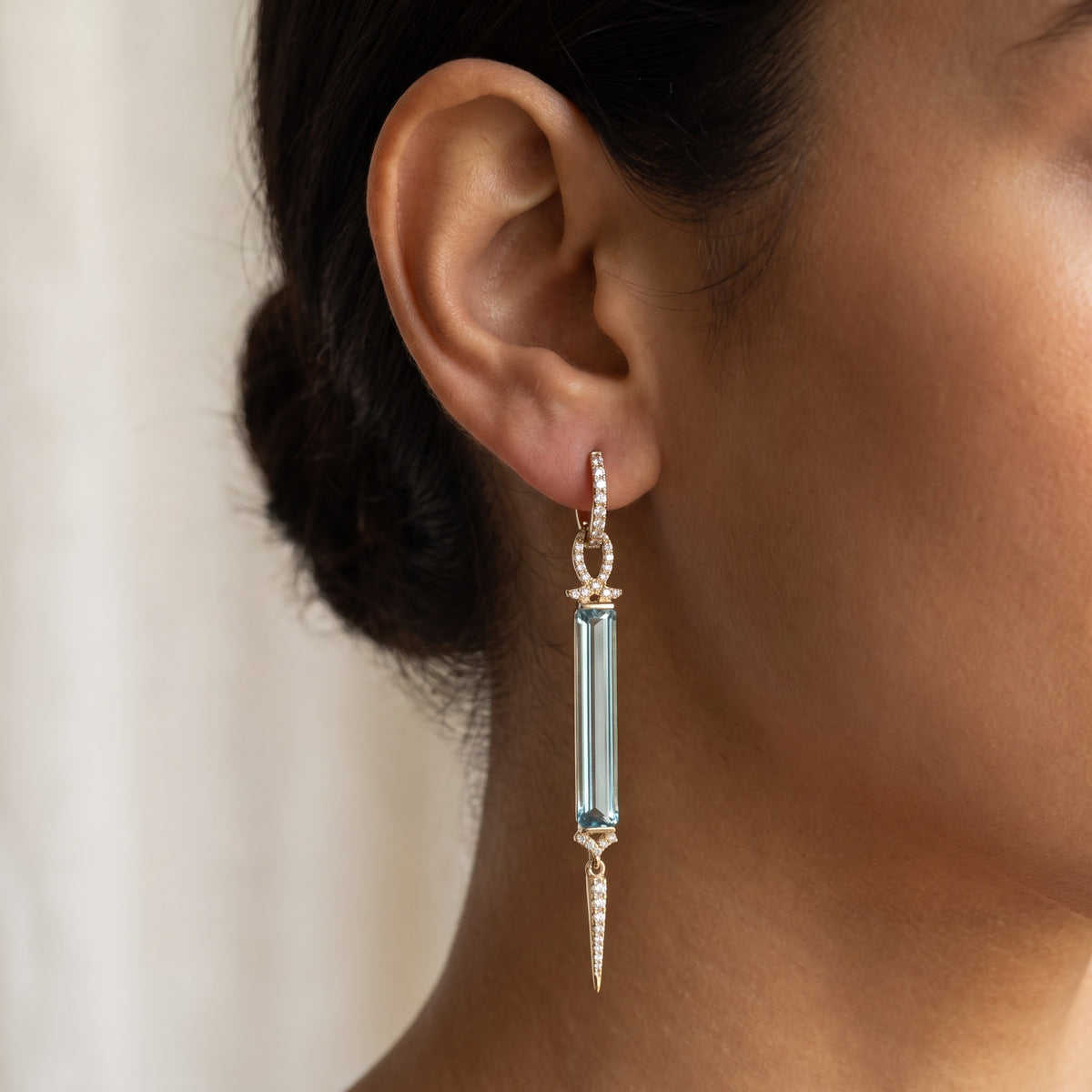Elongated Sky Blue Topaz and Yellow Gold Dangle Earrings, worn