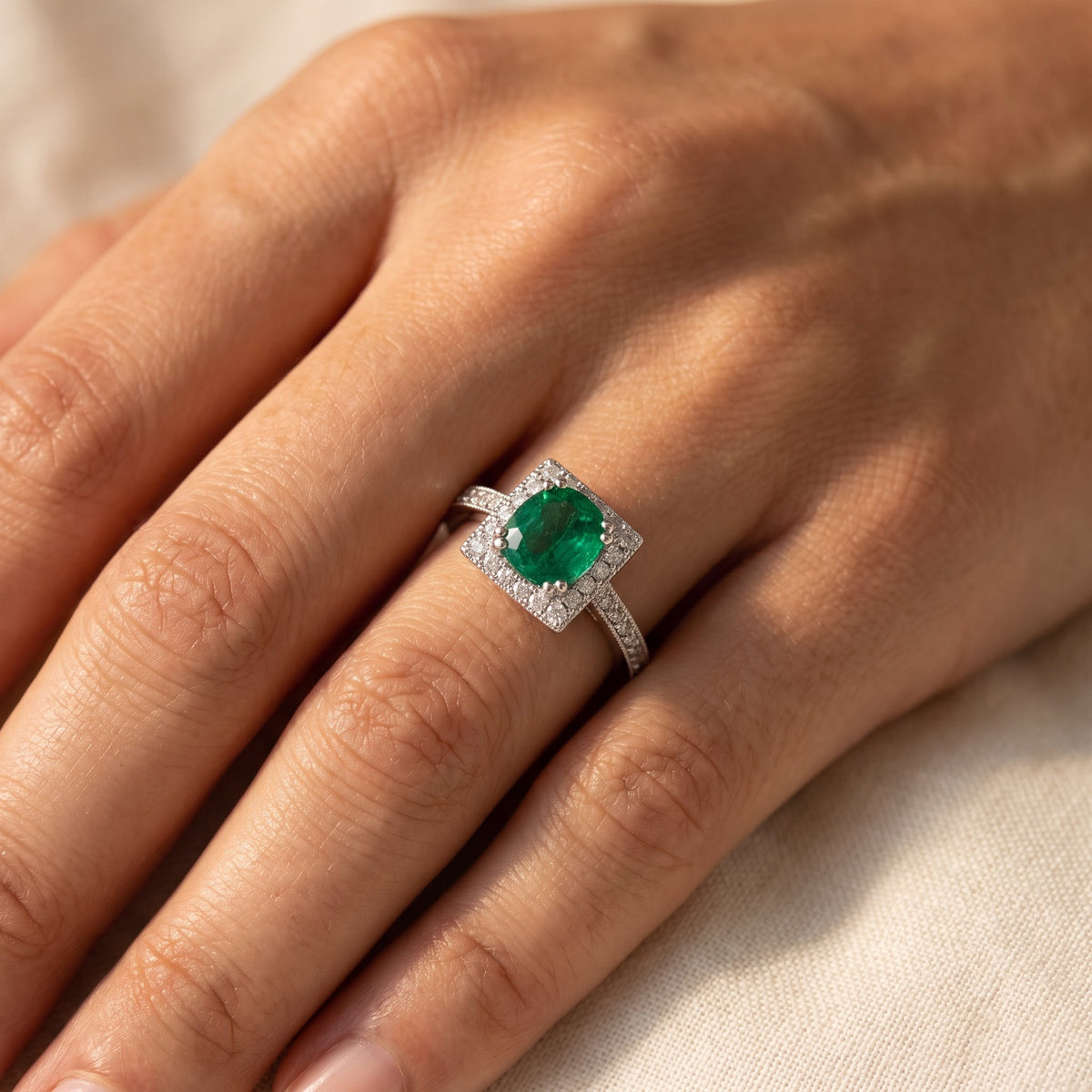 Emerald and White Gold Halo Cocktail Ring, worn