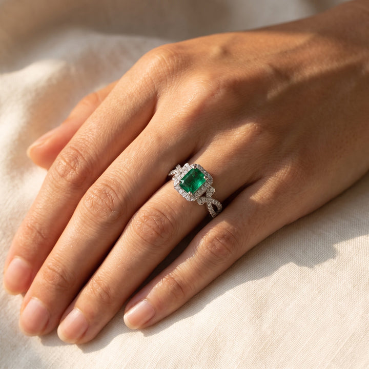 1.01 ct Emerald and Diamond Halo Cocktail Ring with Twisted Band in 14K White Gold, worn
