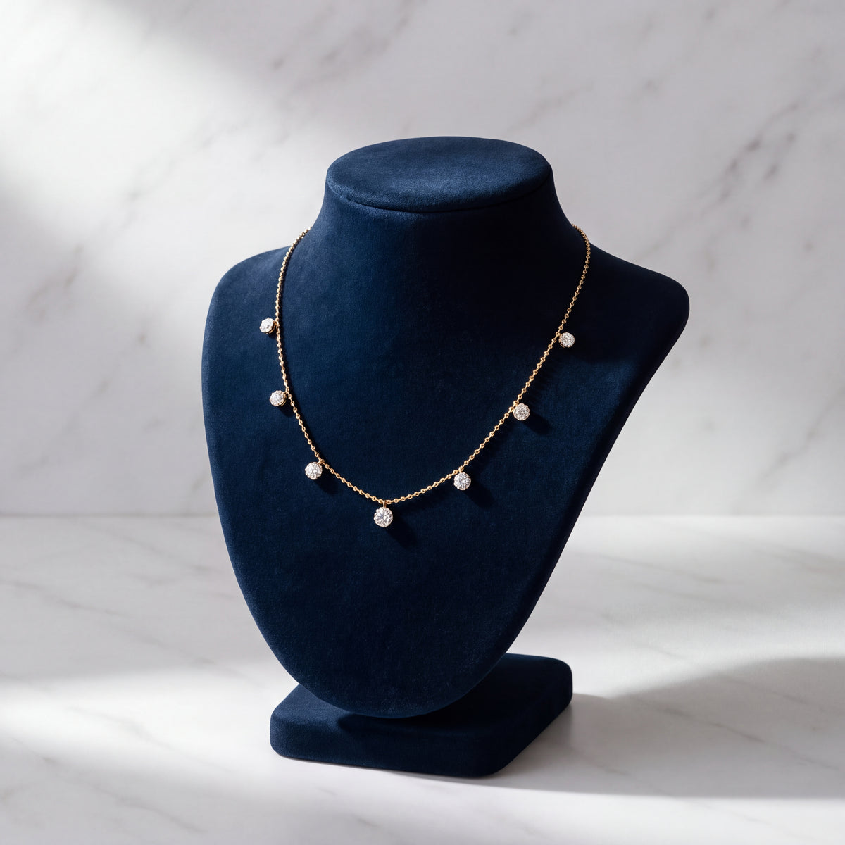 Yellow gold chain with small diamonds dangling at even stations