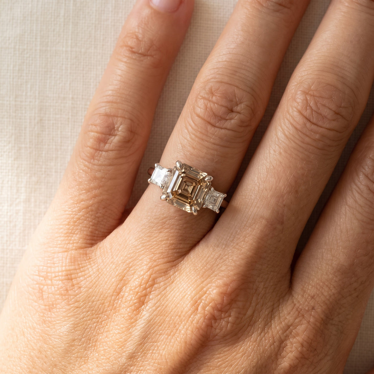 Fancy Brown Diamond Three-Stone Ring in White Gold, worn
