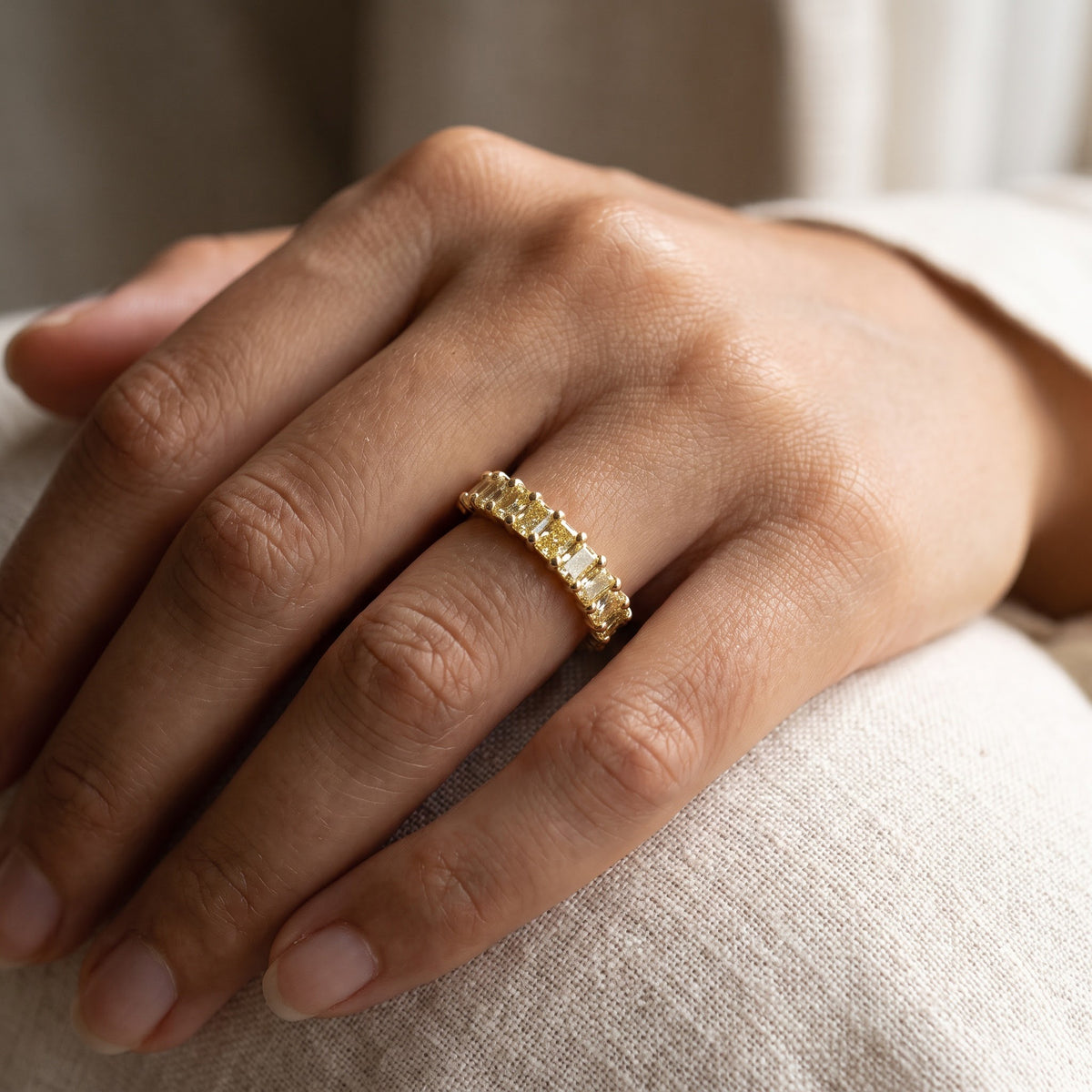 Fancy Yellow Diamond Shared Prong Band in Yellow Gold, worn