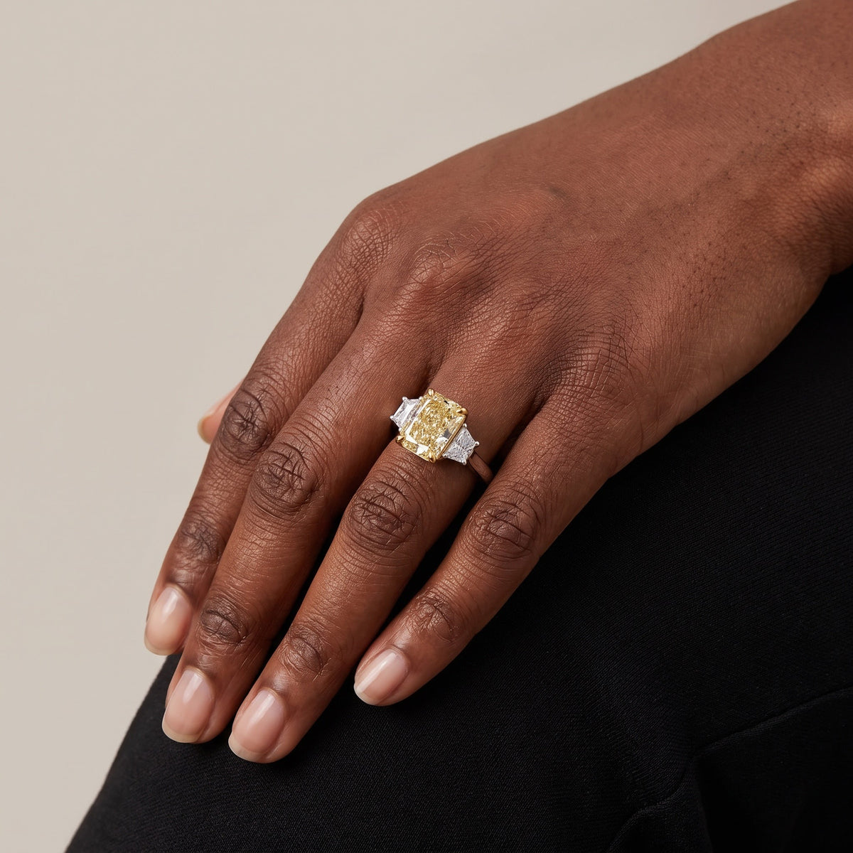 Elongated Radiant Cut Fancy Yellow Diamond Three-Stone Ring in White Gold, worn