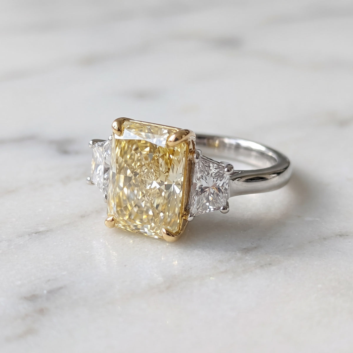 Elongated Radiant Cut Fancy Yellow Diamond Three-Stone Ring in White Gold