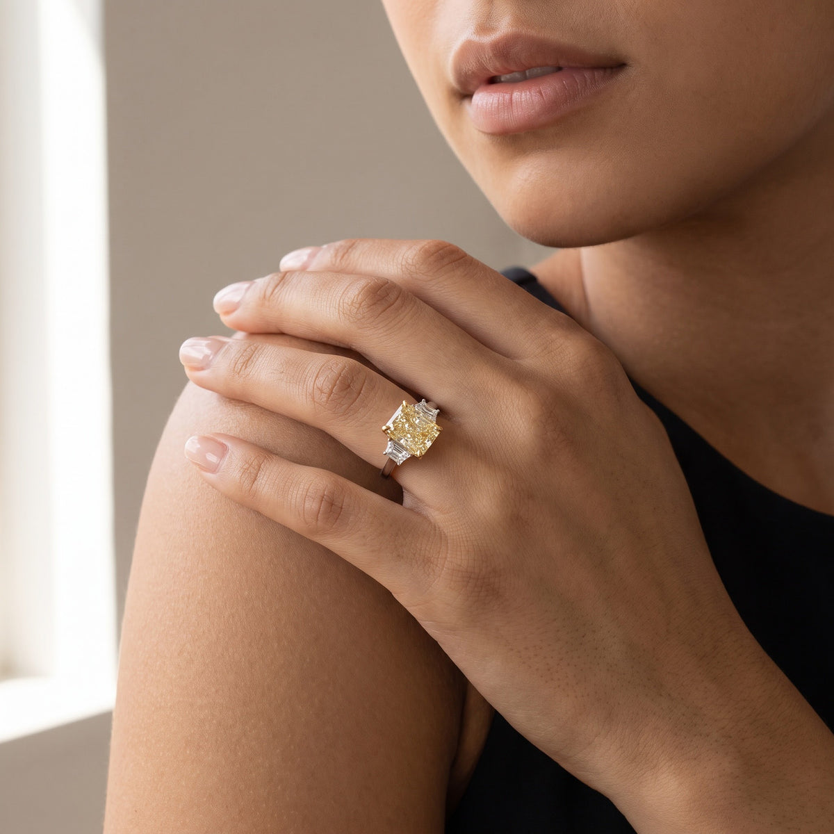 Radiant Cut Fancy Yellow Diamond Three-Stone Ring in White Gold, worn