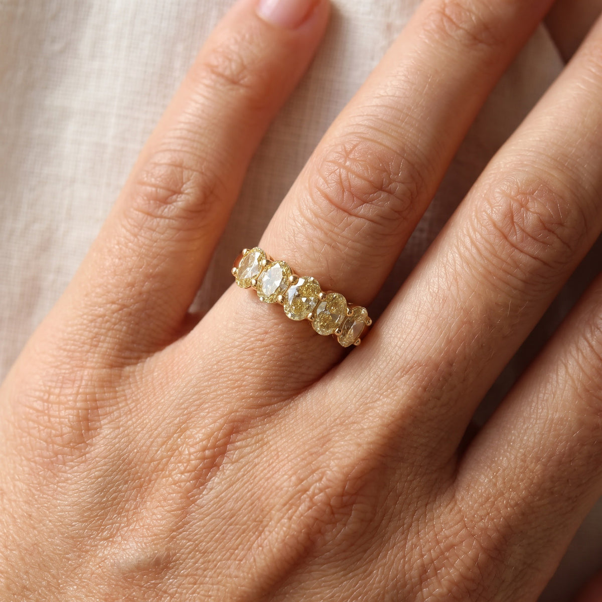 Fancy Yellow Oval Diamond Five-Stone Ring in Yellow Gold, worn