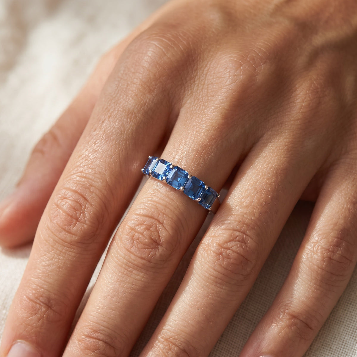 Five-Stone Medium Blue Sapphire Ring in White Gold, worn