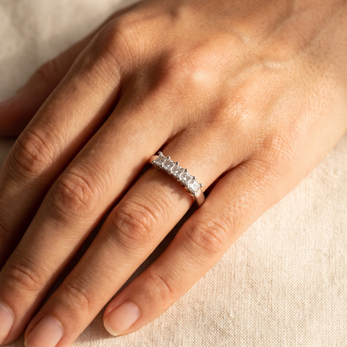 Five-Stone Princess Cut Diamond Ring in White Gold, worn