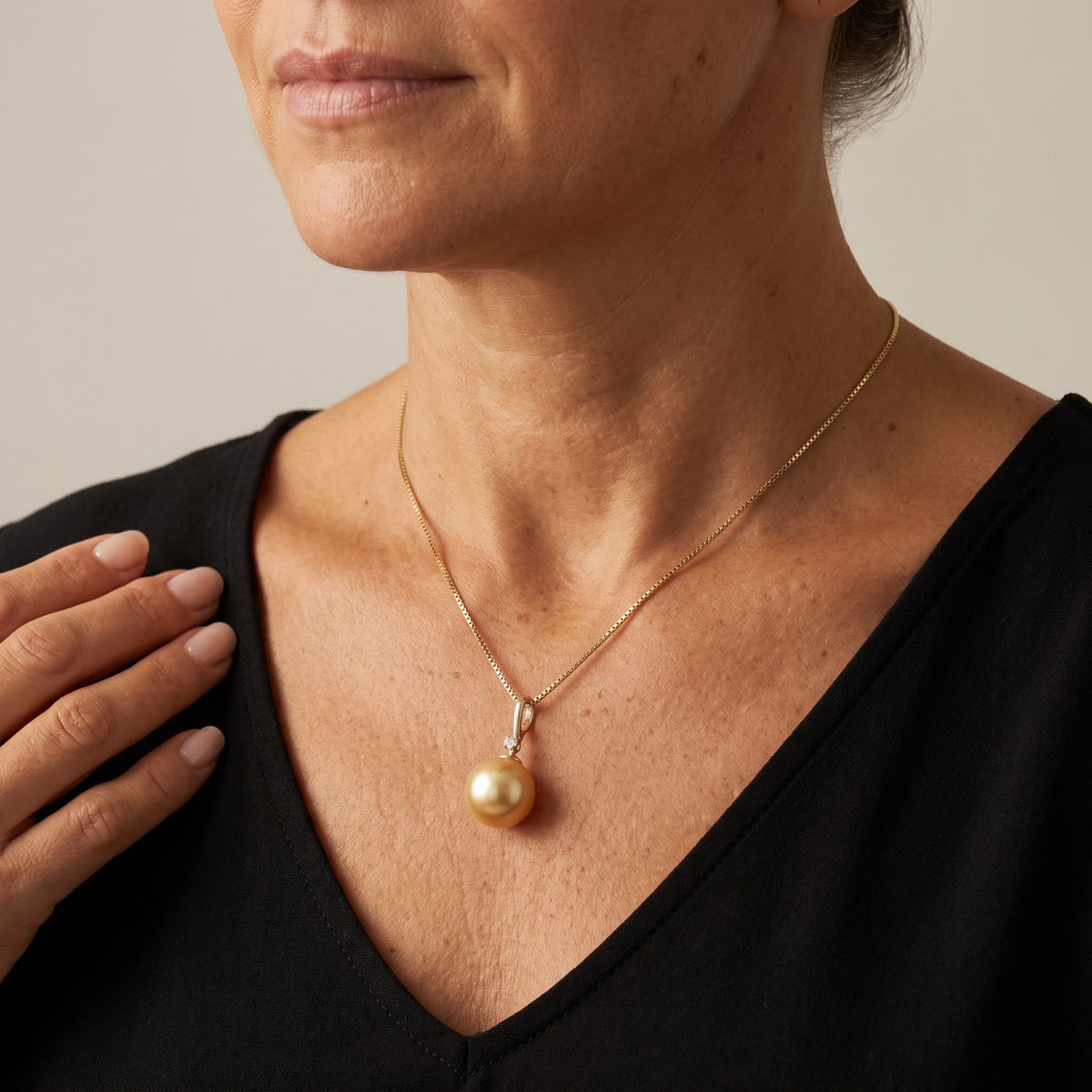 Golden Pearl Pendant Necklace in Yellow Gold, worn, second view