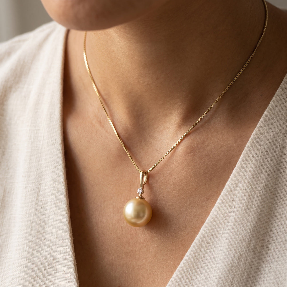 Golden Pearl Pendant Necklace in Yellow Gold, worn