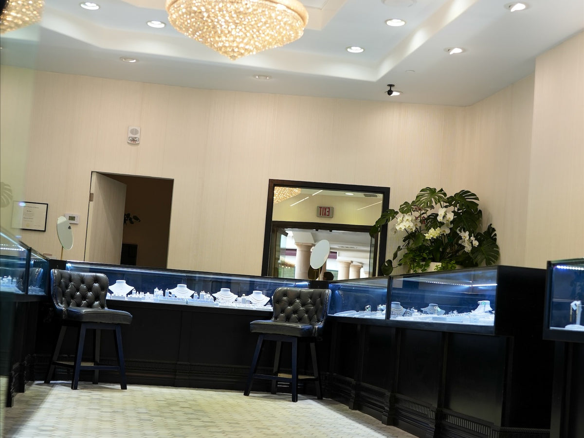 Across the tile floor to the lit cases at Greenleaf Diamonds