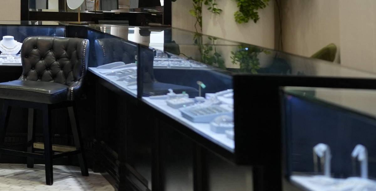 The cases at Greenleaf Diamonds, rings and necklaces under glass