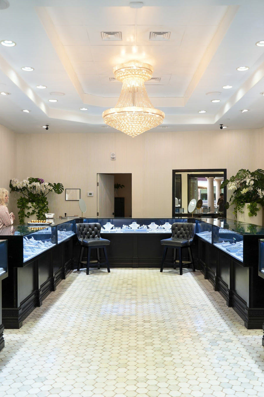 The showroom aisle under the chandelier