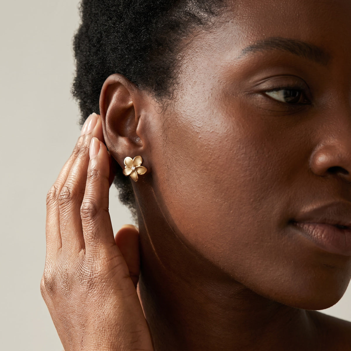 Matte Yellow Gold Plumeria Diamond Stud Earrings, worn, second view